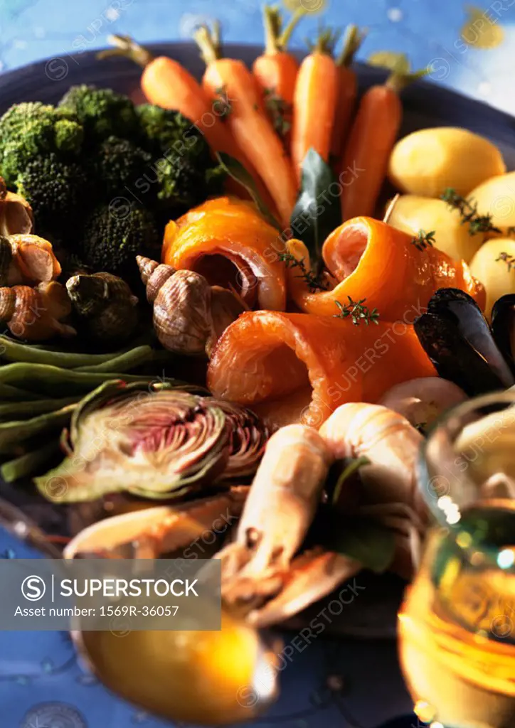 Large plate full of vegetables and seafood, close-up