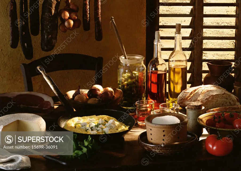 Table spread with various foods and cooking ingredients