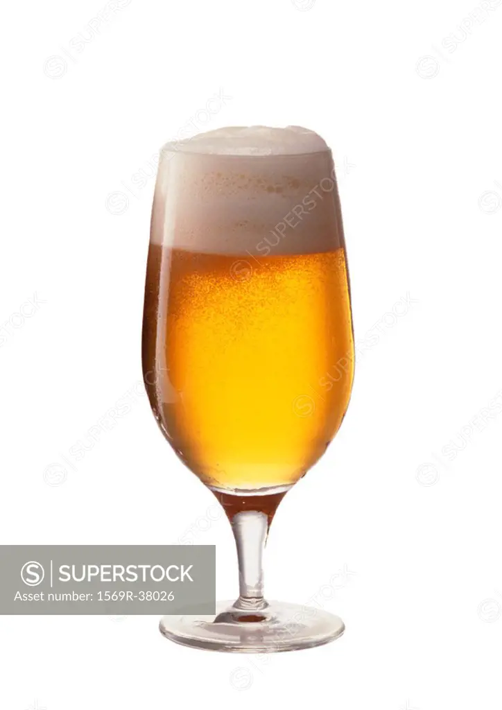Beer in stemmed glass, full length, white background