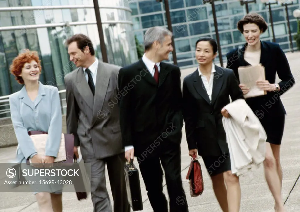 Group of business people walking side by side
