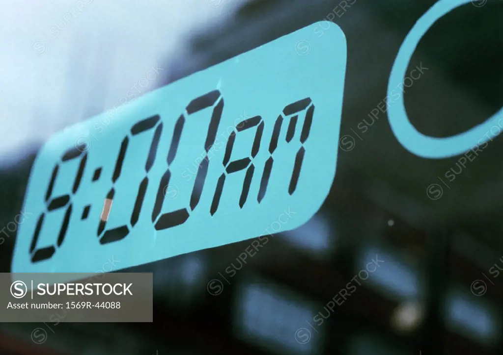 ´8:00AM´ text on alarm clock screen, close-up