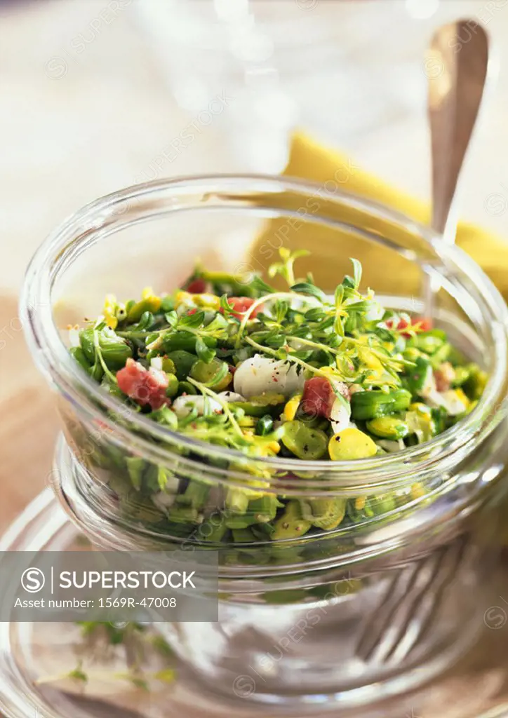 Mixed salad in glass bowl, close-up