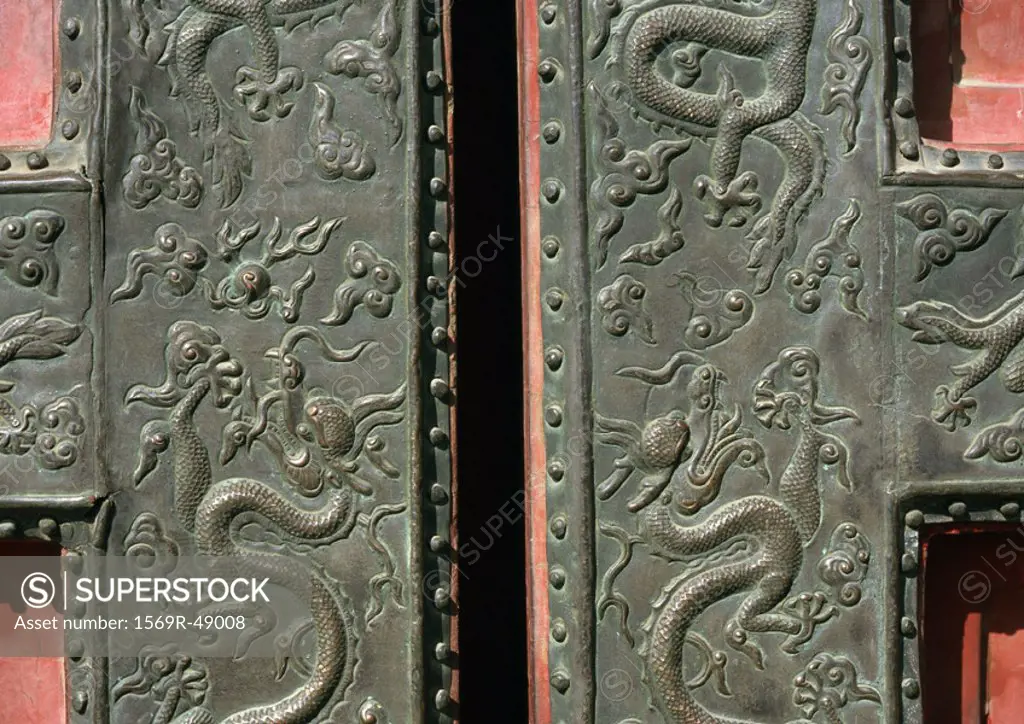 China, Beijing, Forbidden City, dragon motif carving on door
