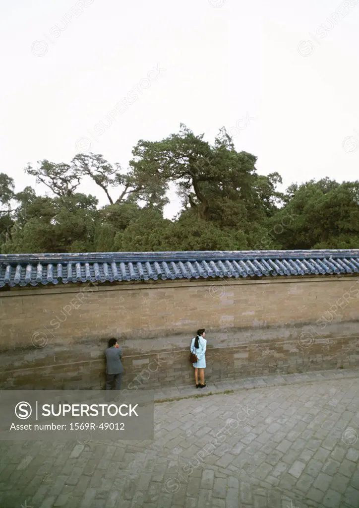 China, Beijing, Tian Tan Temple of Heaven, two people close to the Echo Wall