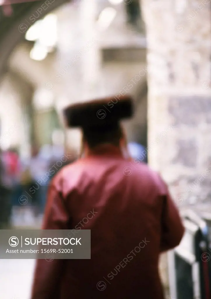 Orthodox Jew, rear view, blurred