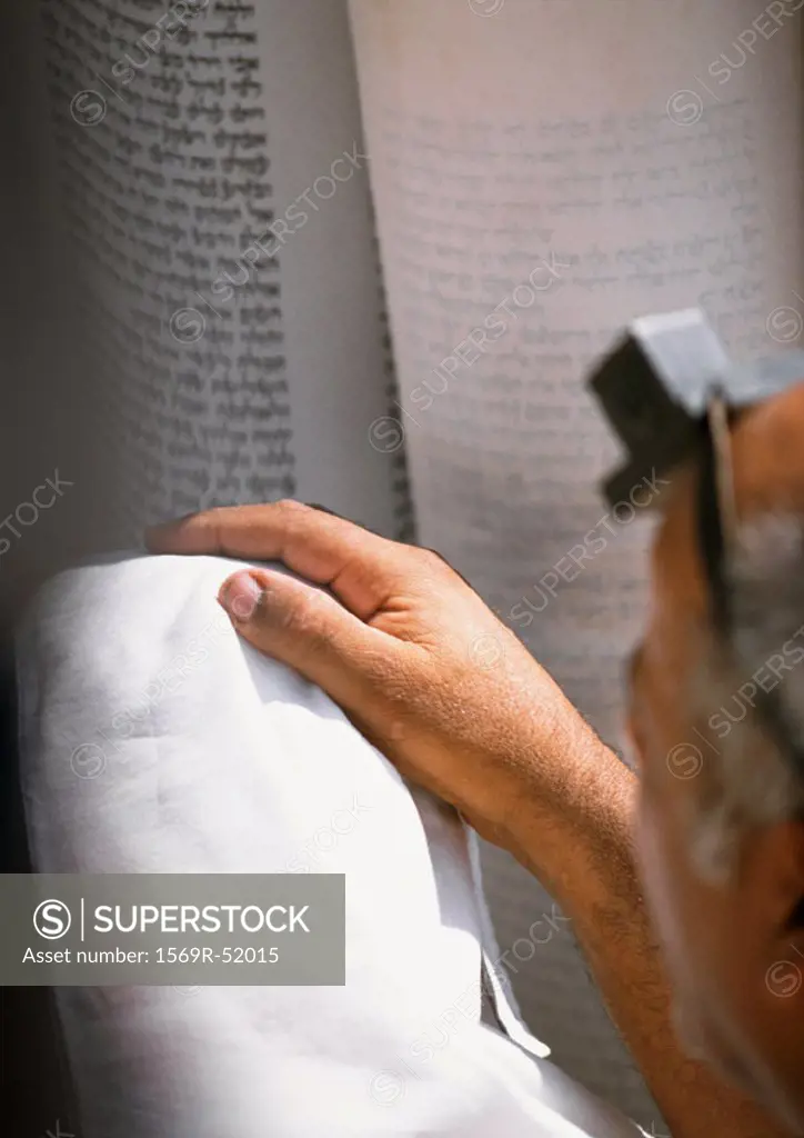 Hand, Torah in background