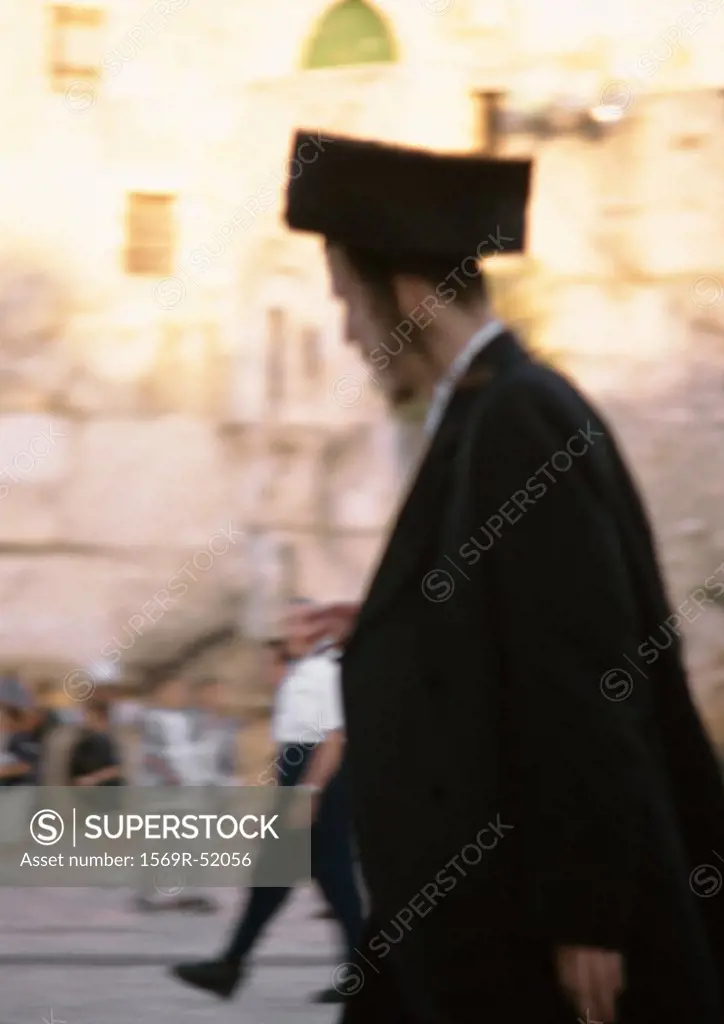 Israel, Jerusalem, Orthodox Jew, side view, blurred