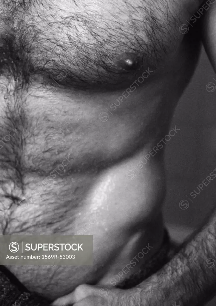 Man´s bare torso, partial view, close-up, b&w
