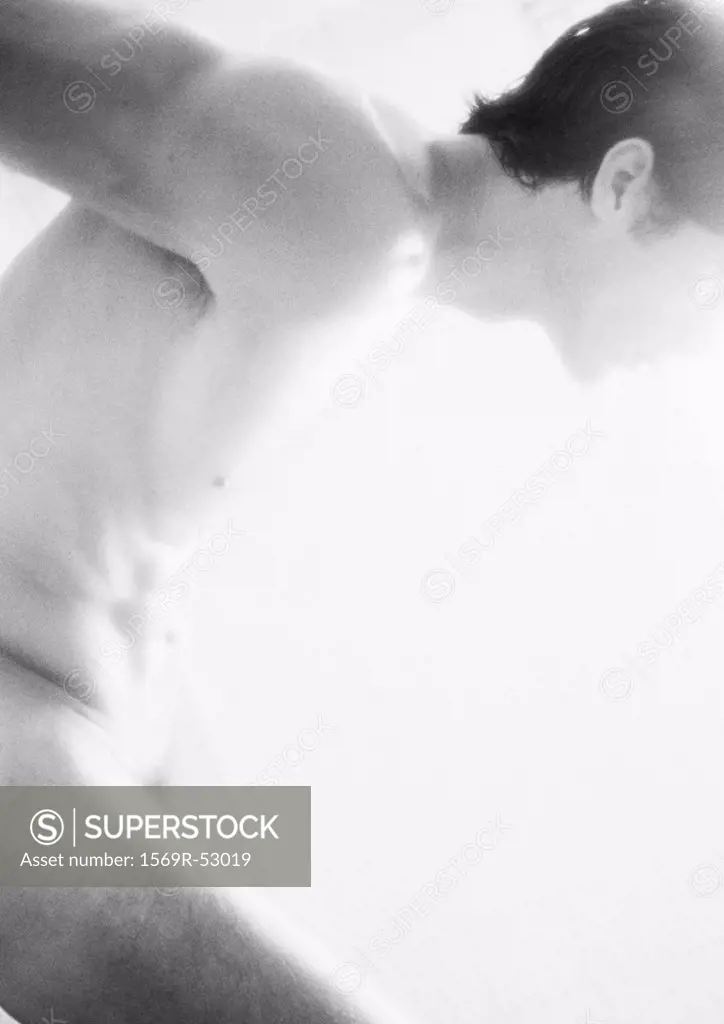 Nude man, side view, blurred, b&w