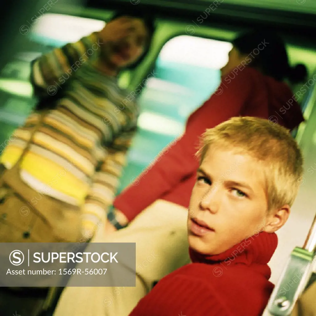 Teenagers in train, blurred backbround