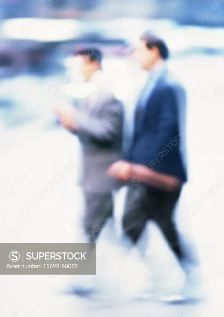 Businessmen walking, blurred