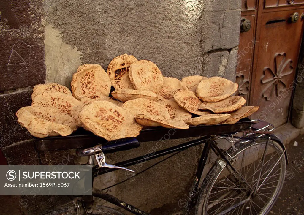 Syria, pita bread being sold, placed on bicycle