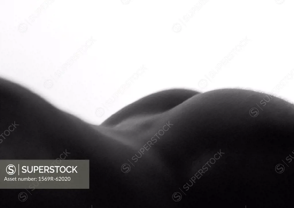 Man´s bare back and buttocks, close up, black and white