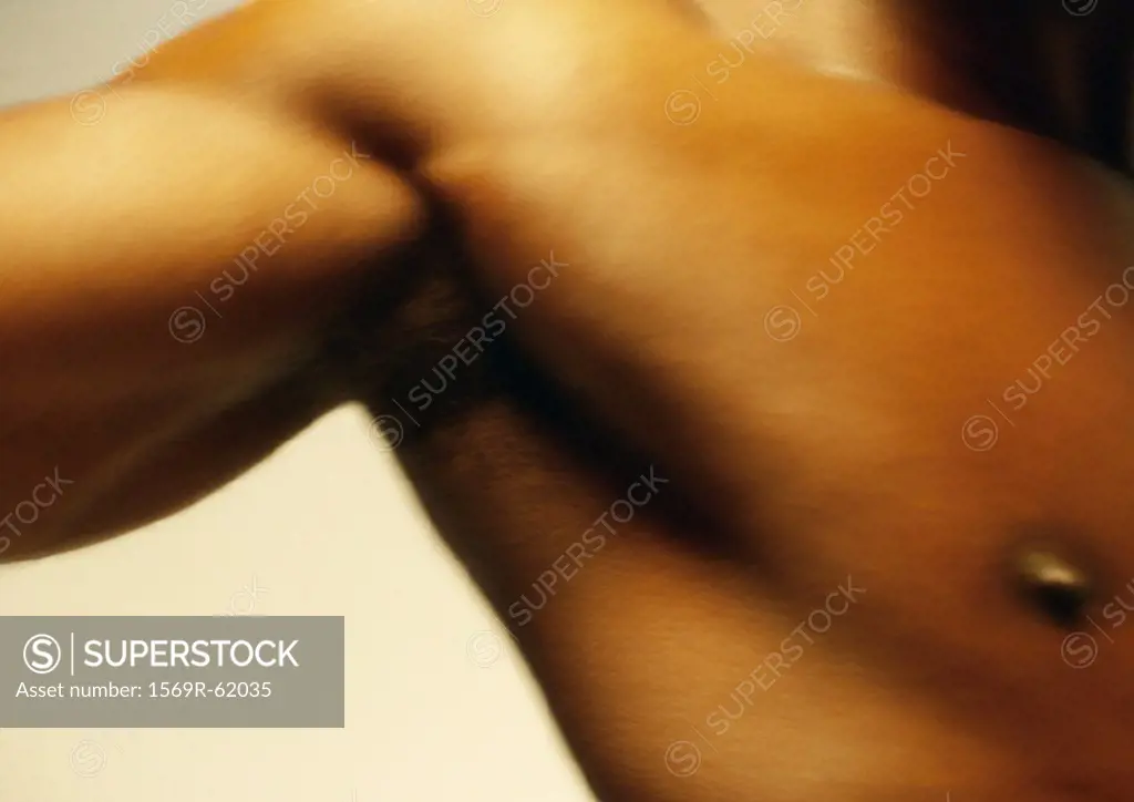 Man´s bare chest and bicep, close up