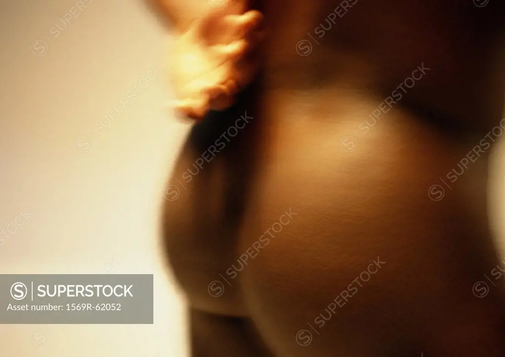 Man´s bare buttocks and hand, close up