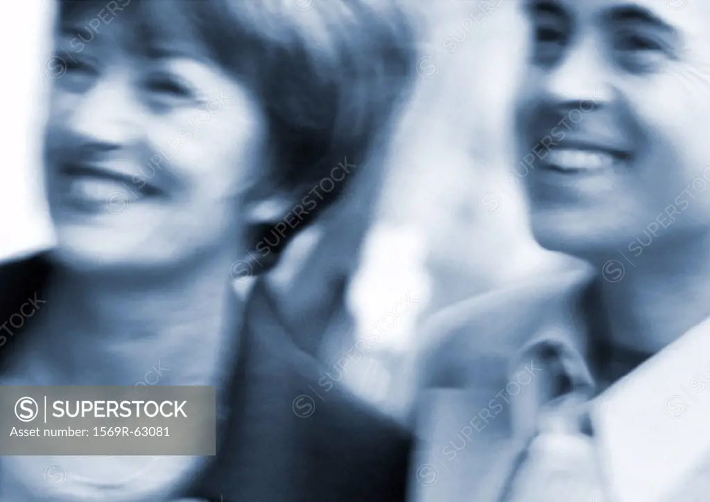 Man and woman smiling, close up, blurred, black and white