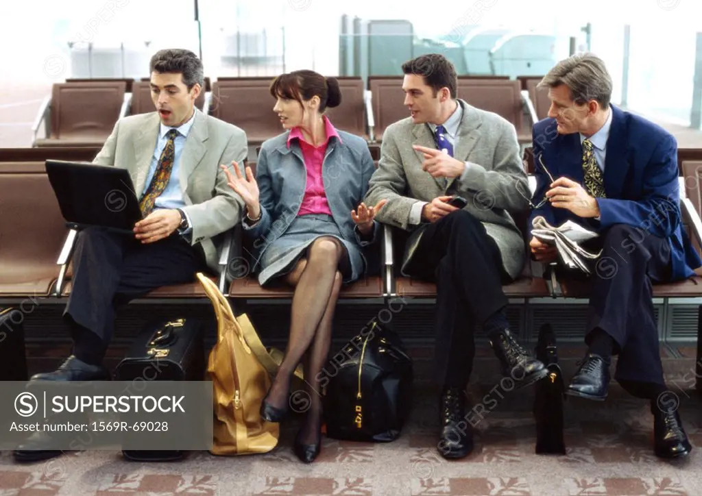 Group of business people sitting in terminal