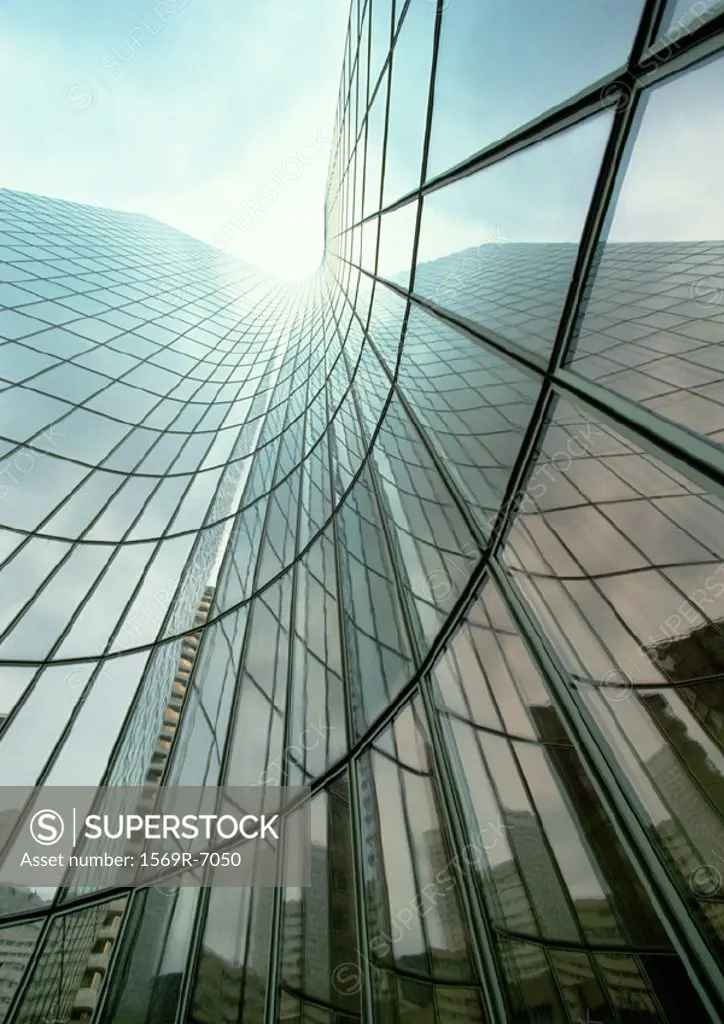 France, Paris, skyscraper with glass facade, reflection, low angle view