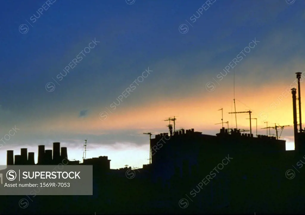 France, Paris, rooftops silhouetted at twilight