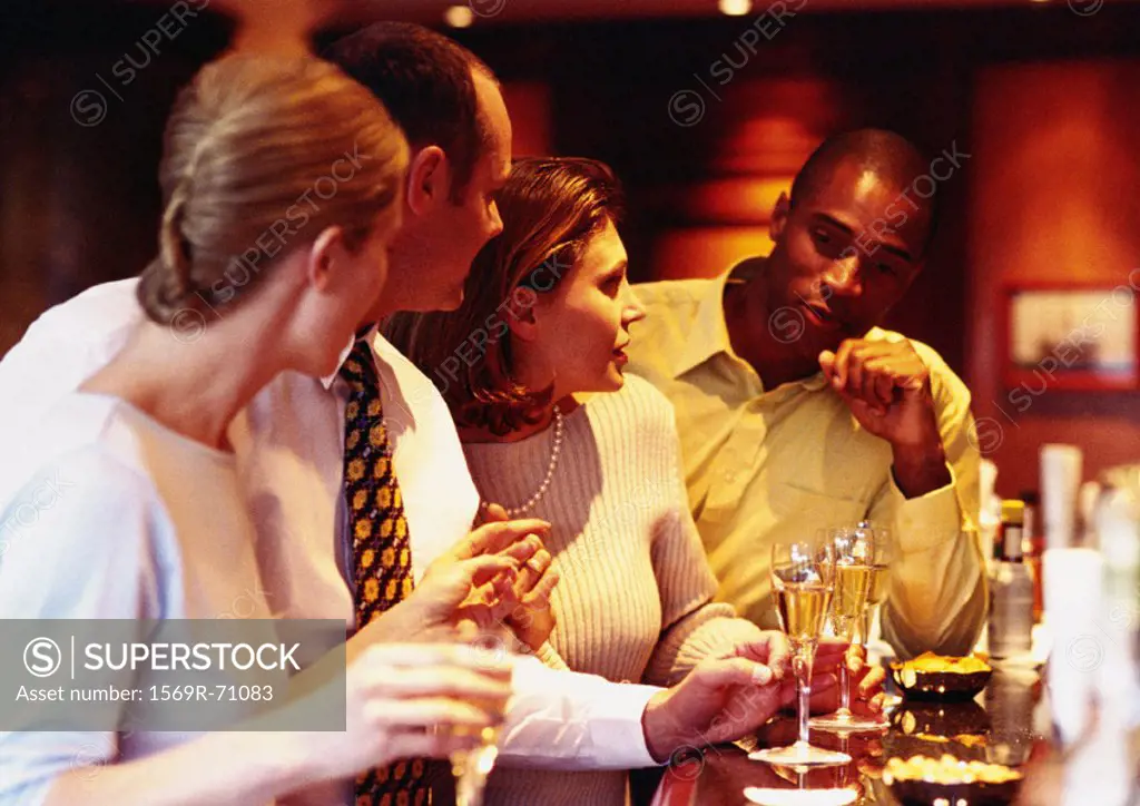 Group of business people socializing at bar