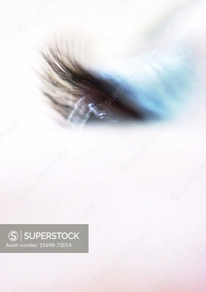 Woman´s eyelashes, blue eye makeup, blurred close up