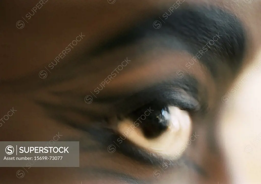 Woman´s brown eye, side view, blurred