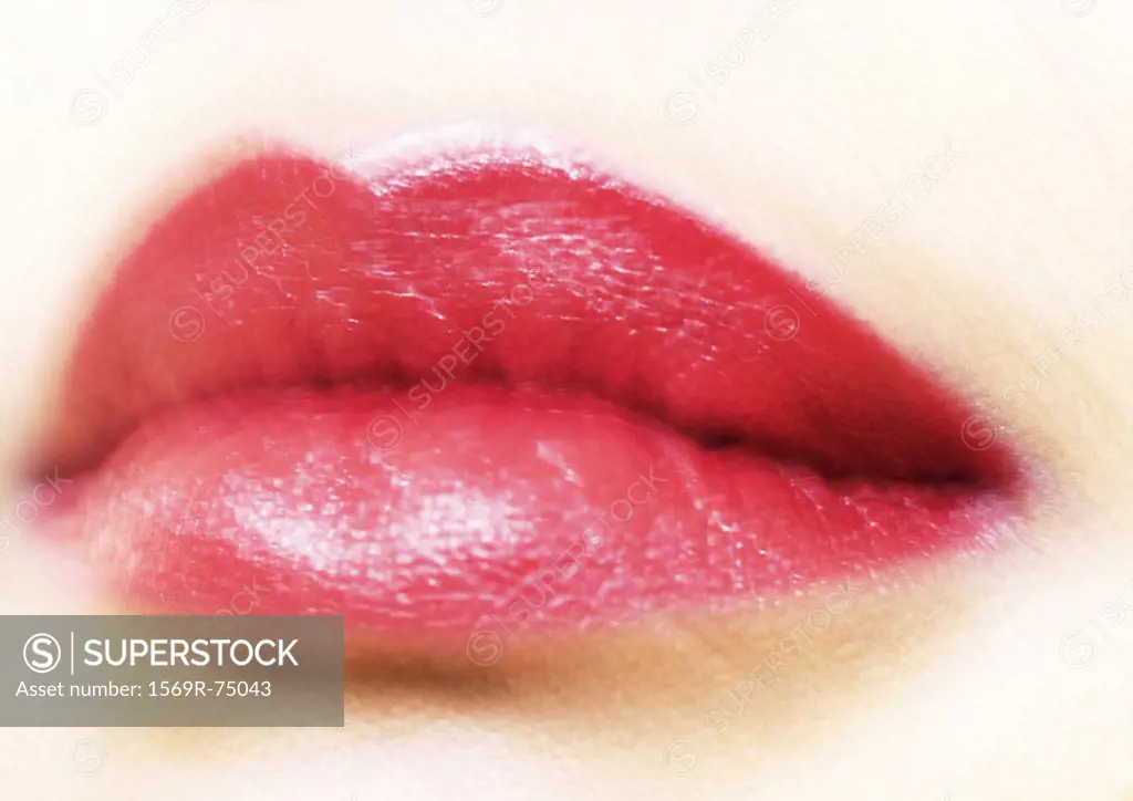 Woman´s mouth with lipstick, blurred, extreme close-up