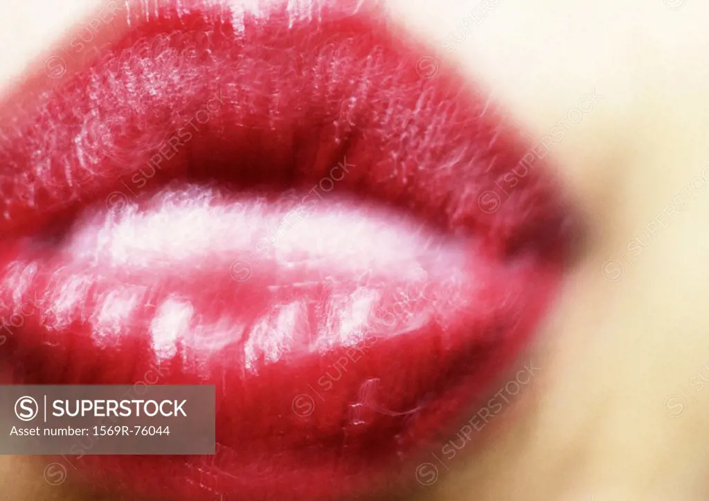 Close up of woman´s mouth puckering, blurry