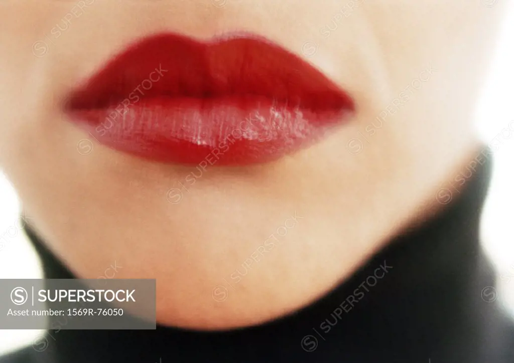 Close up of woman´s mouth with red lipstick