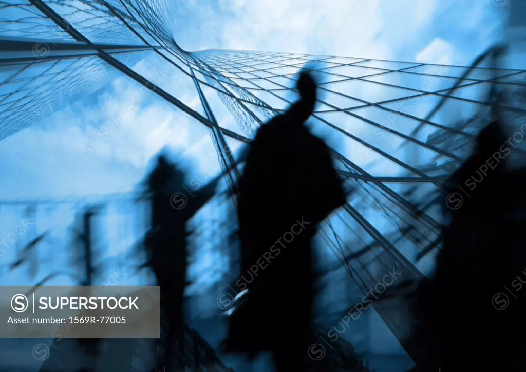 Silhouette of man walking and skyscraper, montage