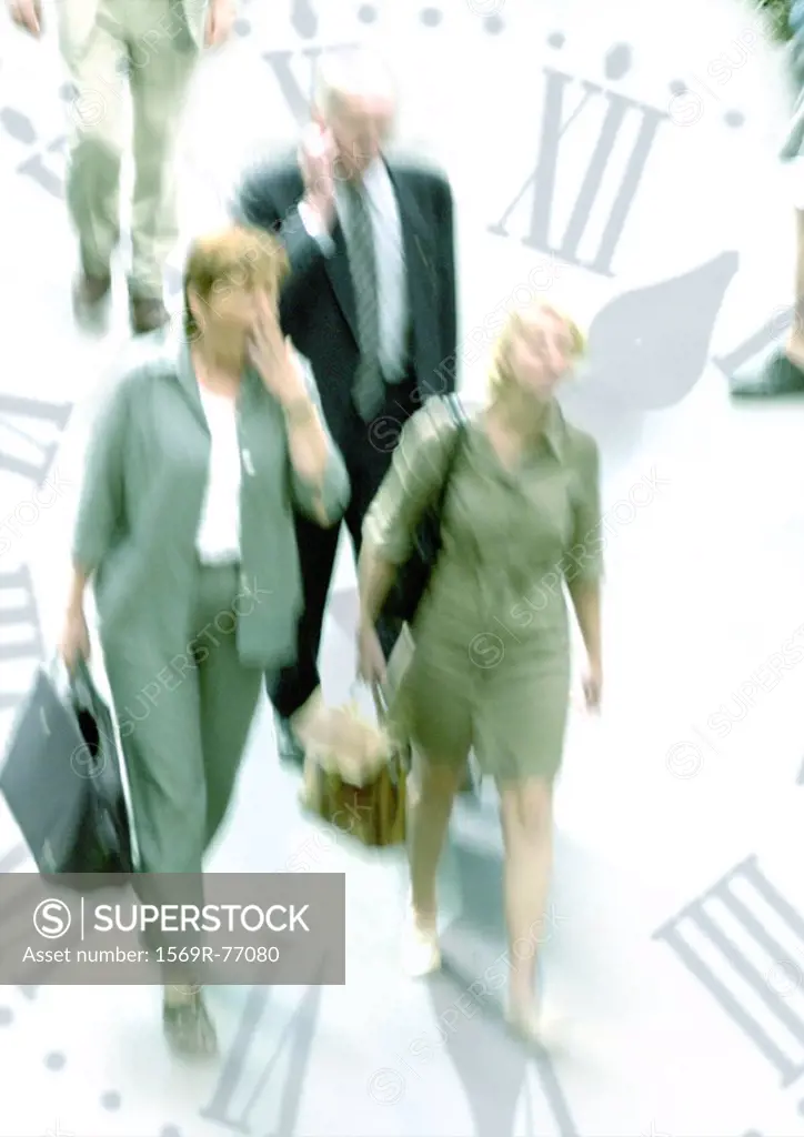 Businesspeople walking through clock, montage