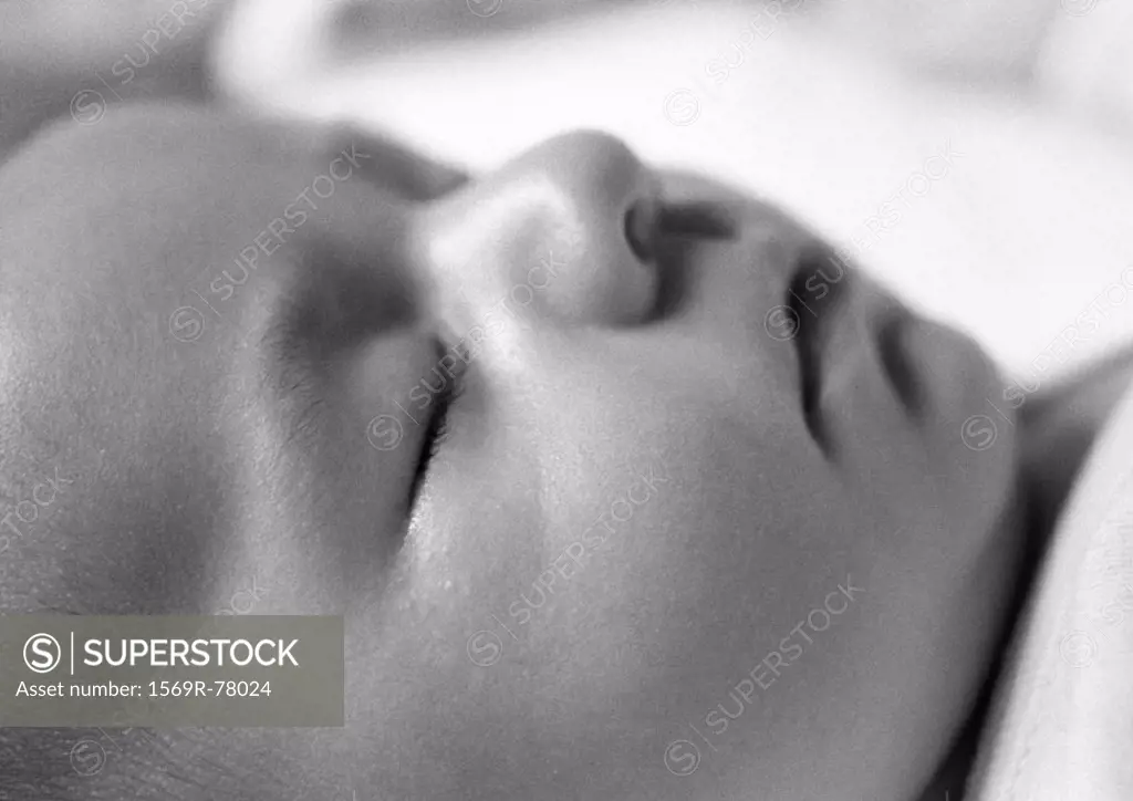 Sleeping baby´s face, side view, close-up, B&W