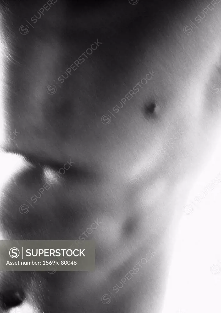Man´s bare chest and abdomen, blurred, close-up, black and white
