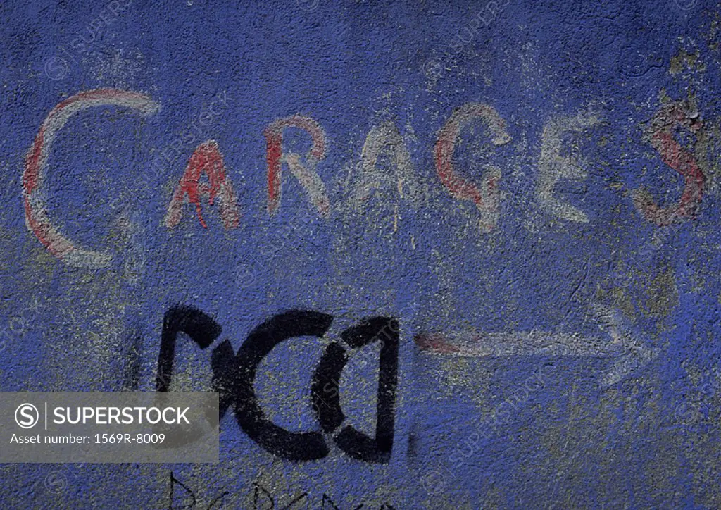 ´Garages´ type painted on blue wall