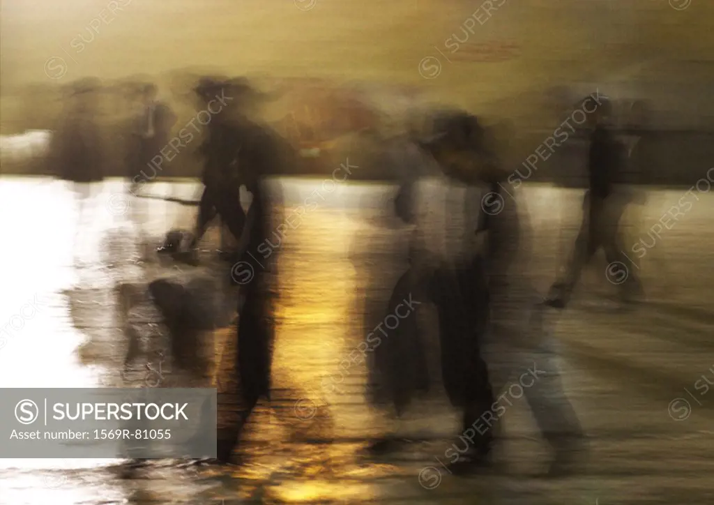 Israel, Jerusalem, people walking at dusk, blurred motion