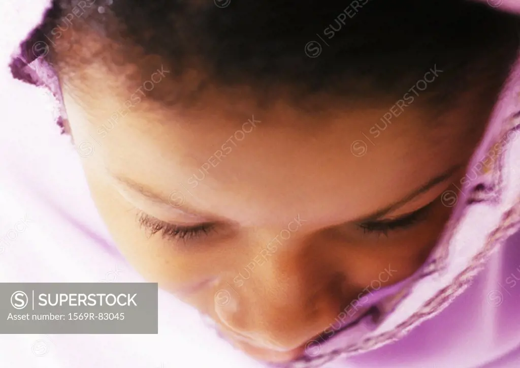 Close up of woman´s face praying, high angle view