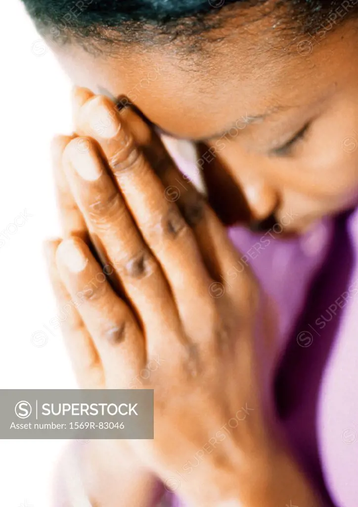 Woman with eyes closed, praying, close-up