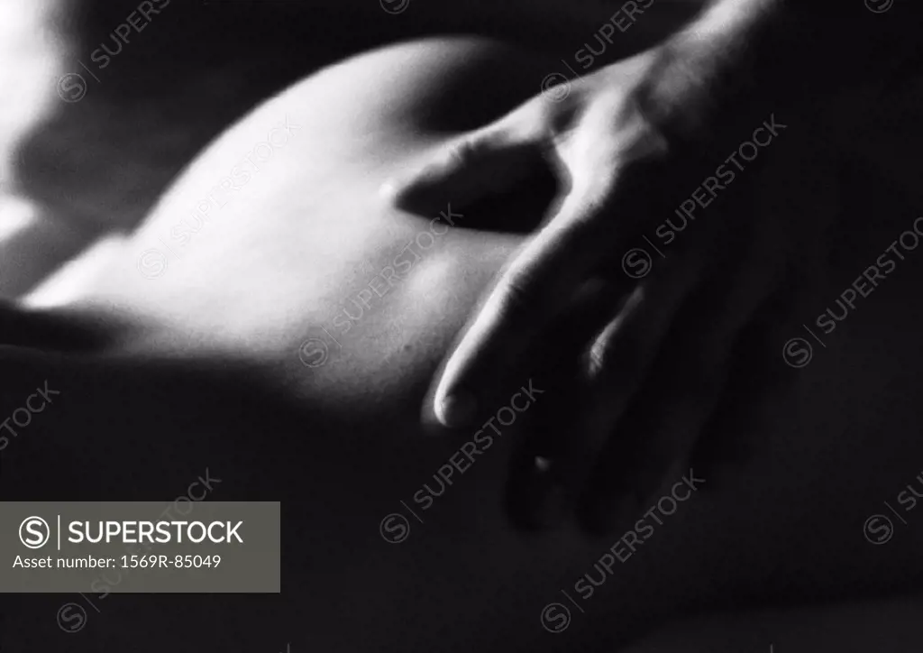 Man´s hand on woman´s buttocks, black and white