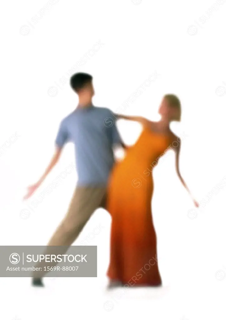 Silhouette of couple dancing, on white background, defocused