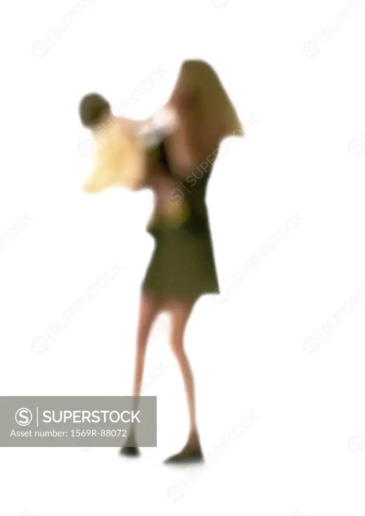 Silhouette of woman holding child, on white background, defocused