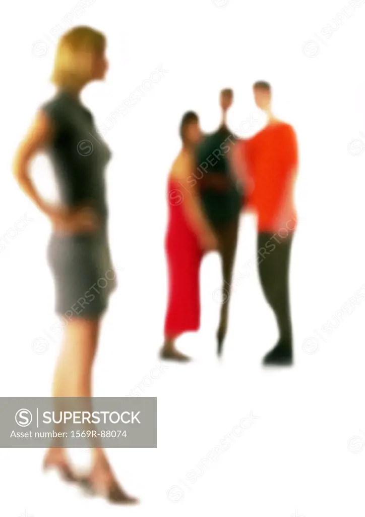 Silhouette of woman standing apart from group of people, on white background, defocused
