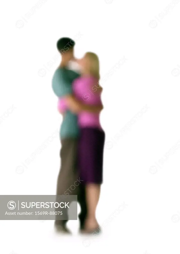 Silhouette of couple hugging and kissing, on white background, defocused