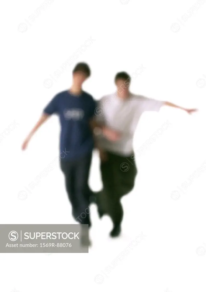 Silhouette of two men arm in arm, on white background, defocused