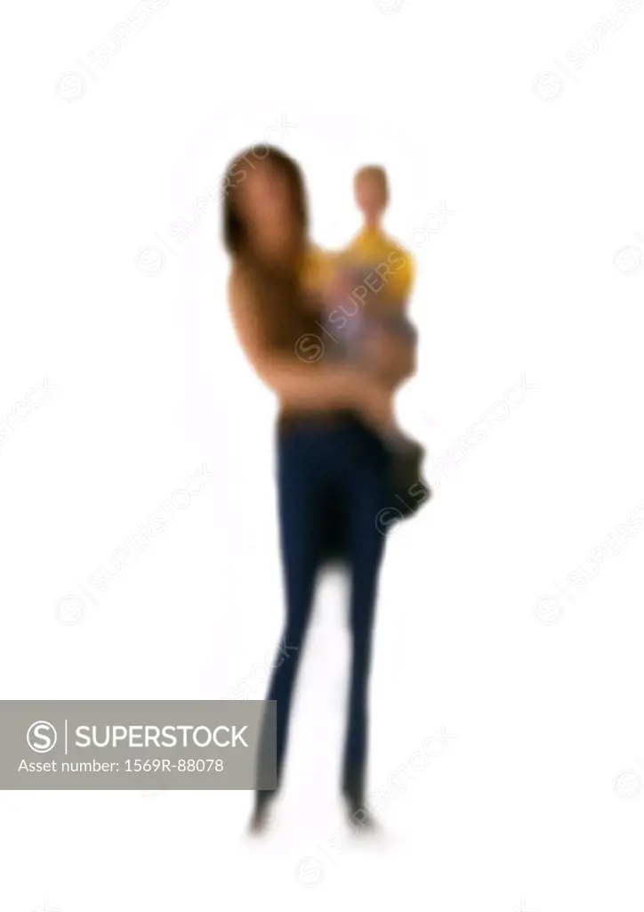 Silhouette of woman holding child on white background, defocused