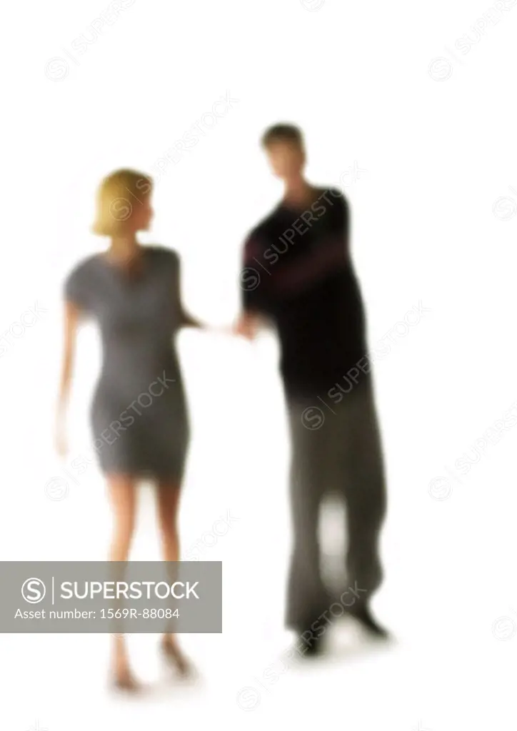 Silhouette of couple, on white background, defocused