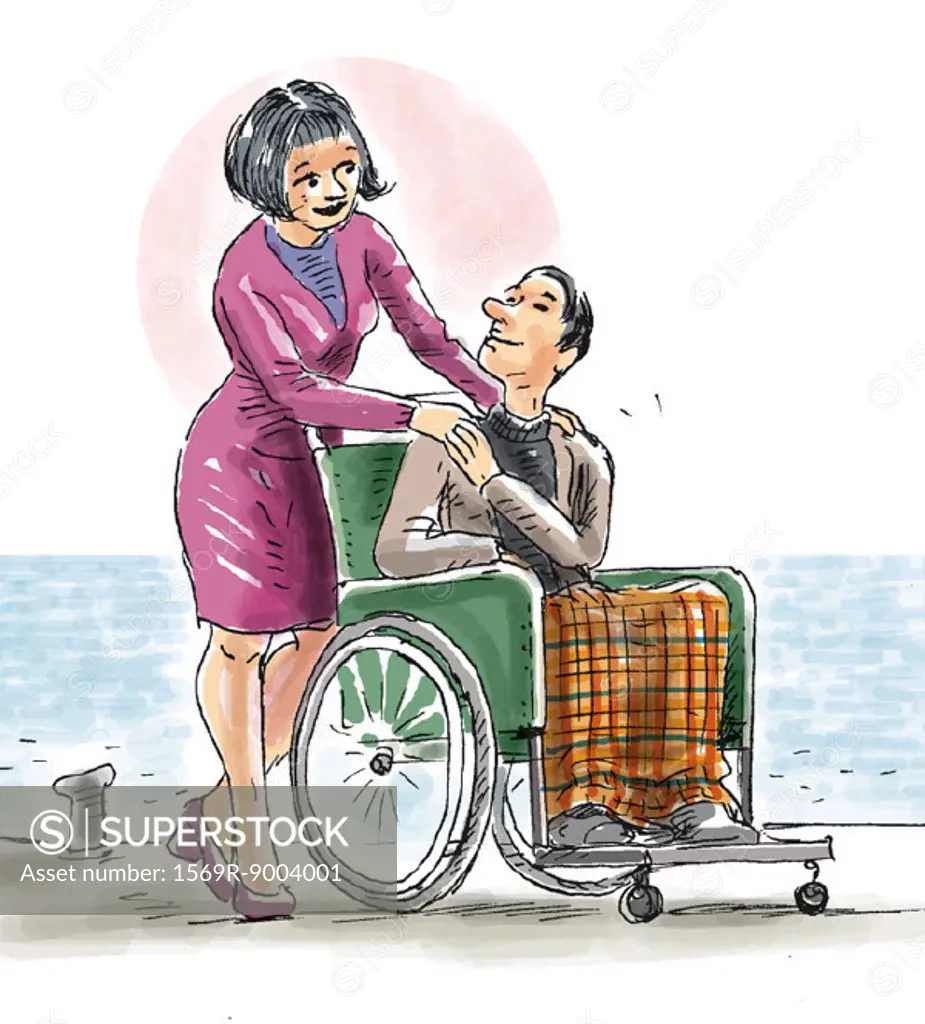 Couple on beach, man in wheelchair