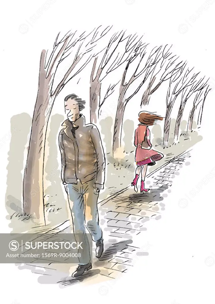 Man and woman walking on path in winter
