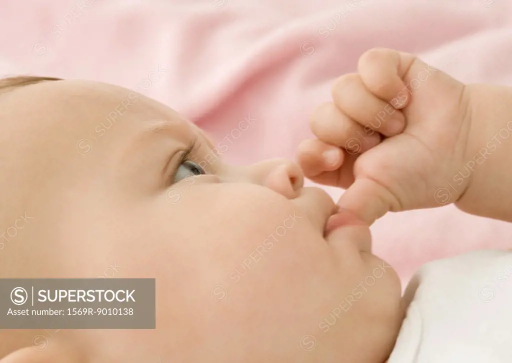 Baby sucking thumb, close-up