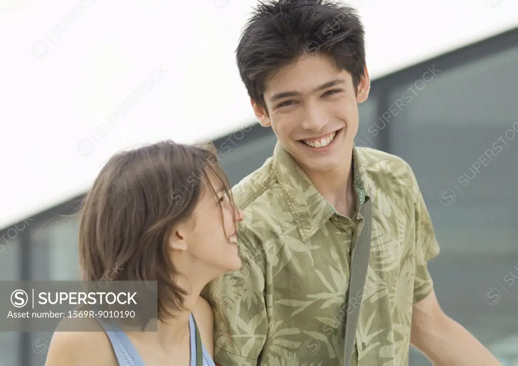 Young man and young woman laughing