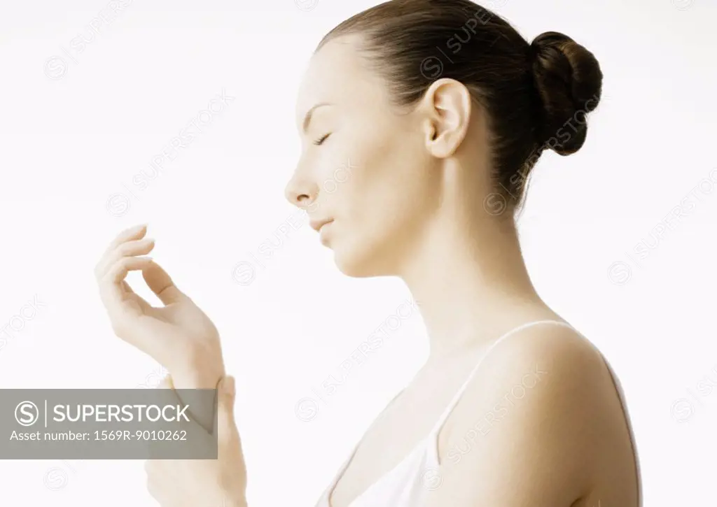 Woman massaging wrist